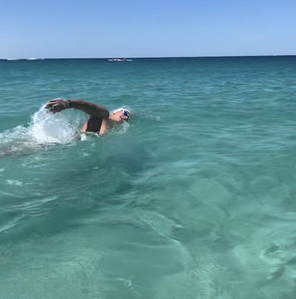 person swimming in ocean